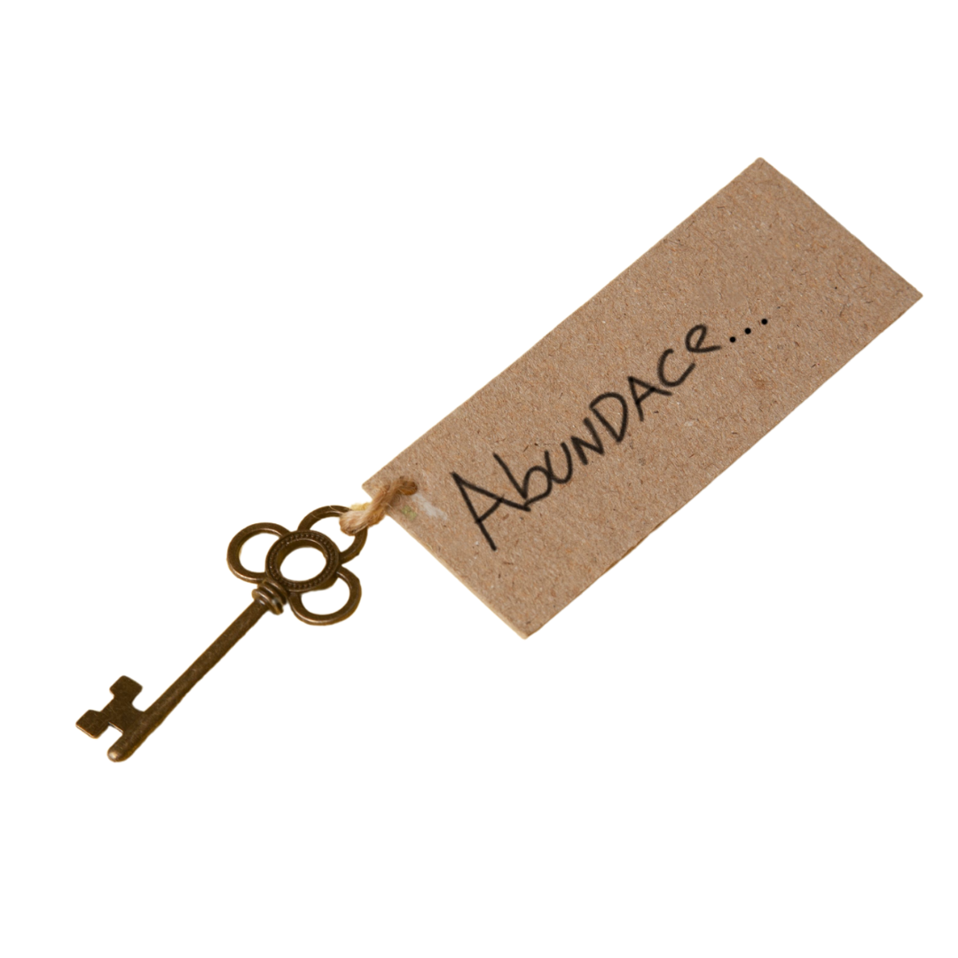 A vintage-style key attached to a brown paper tag with the word "Abundance" written on it, representing the unlocking of a fulfilling and purposeful life.